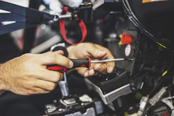Close-up of hands fixing electrical wiring safely and professionally.