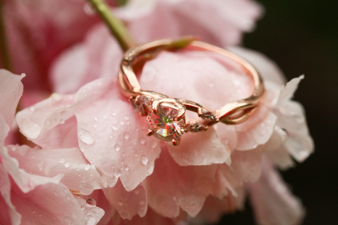 gold ring on pink flower