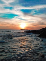 body of water during sunset