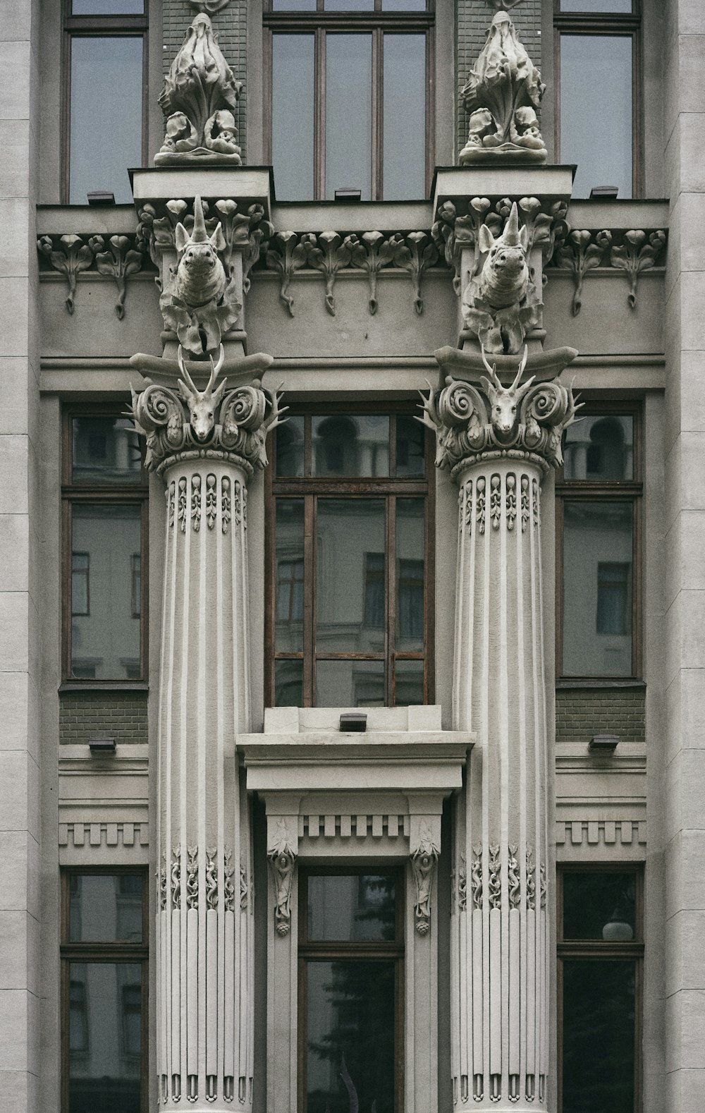 gray concrete building with brown wooden door