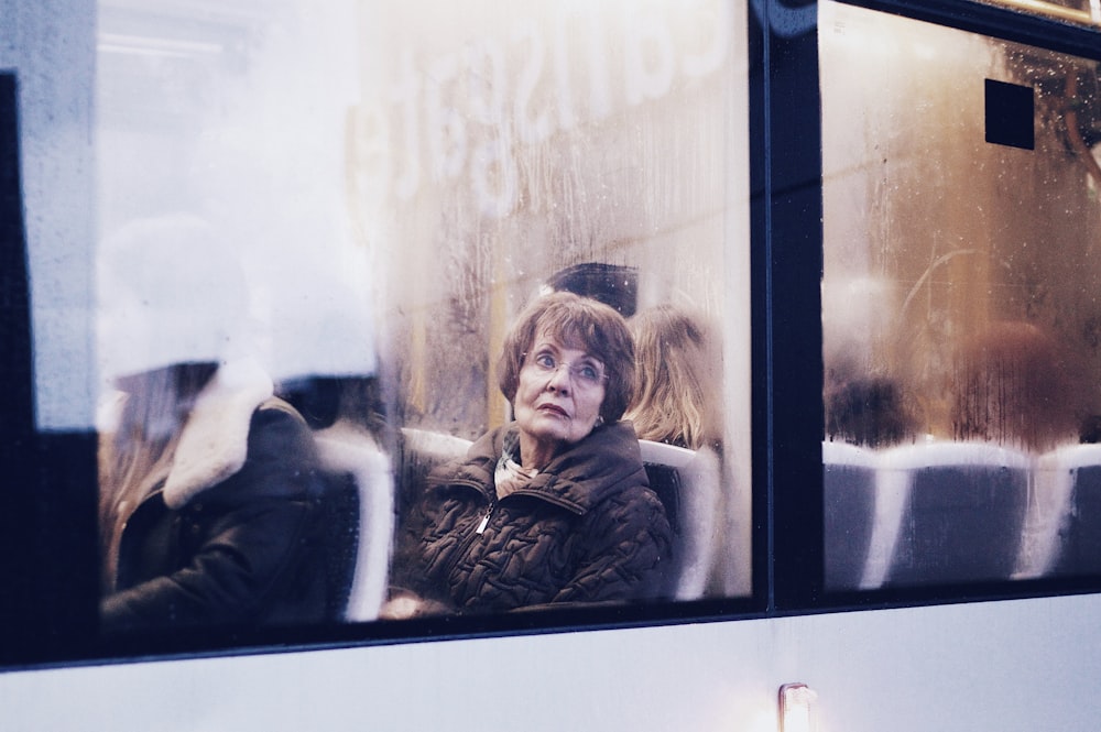 woman in black leather jacket sitting beside woman in black jacket