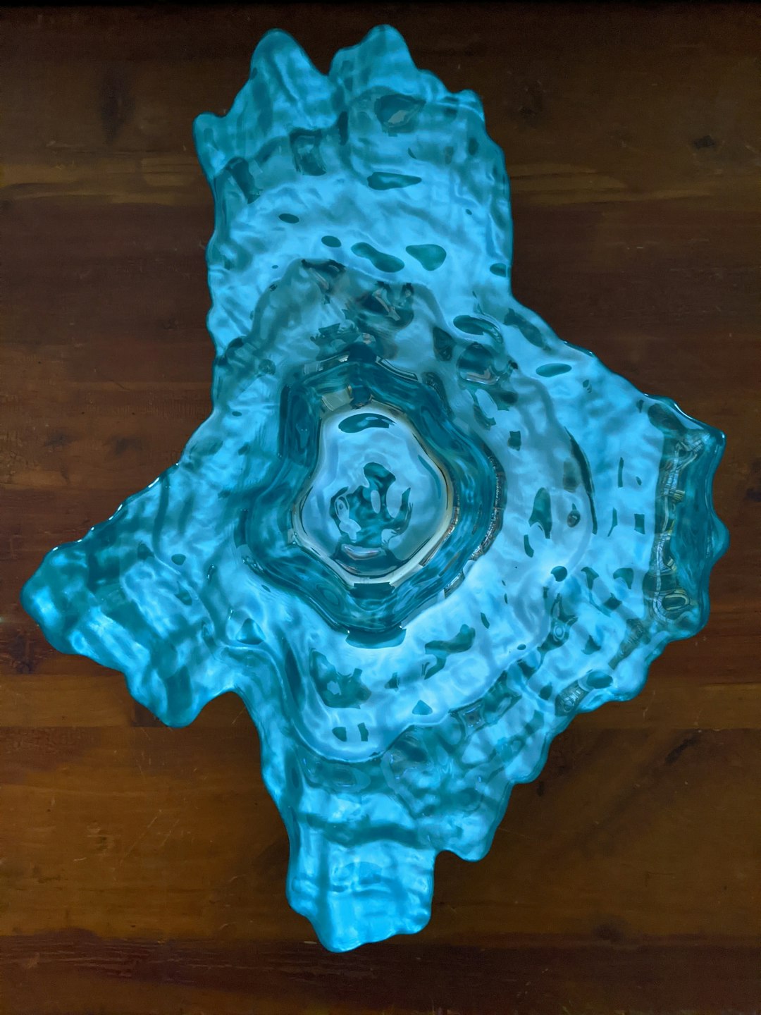 teal clay on brown wooden table