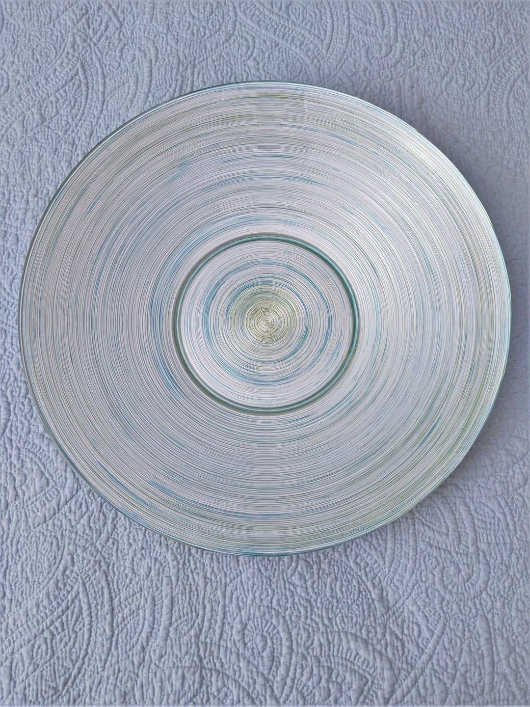 round blue light on gray textile