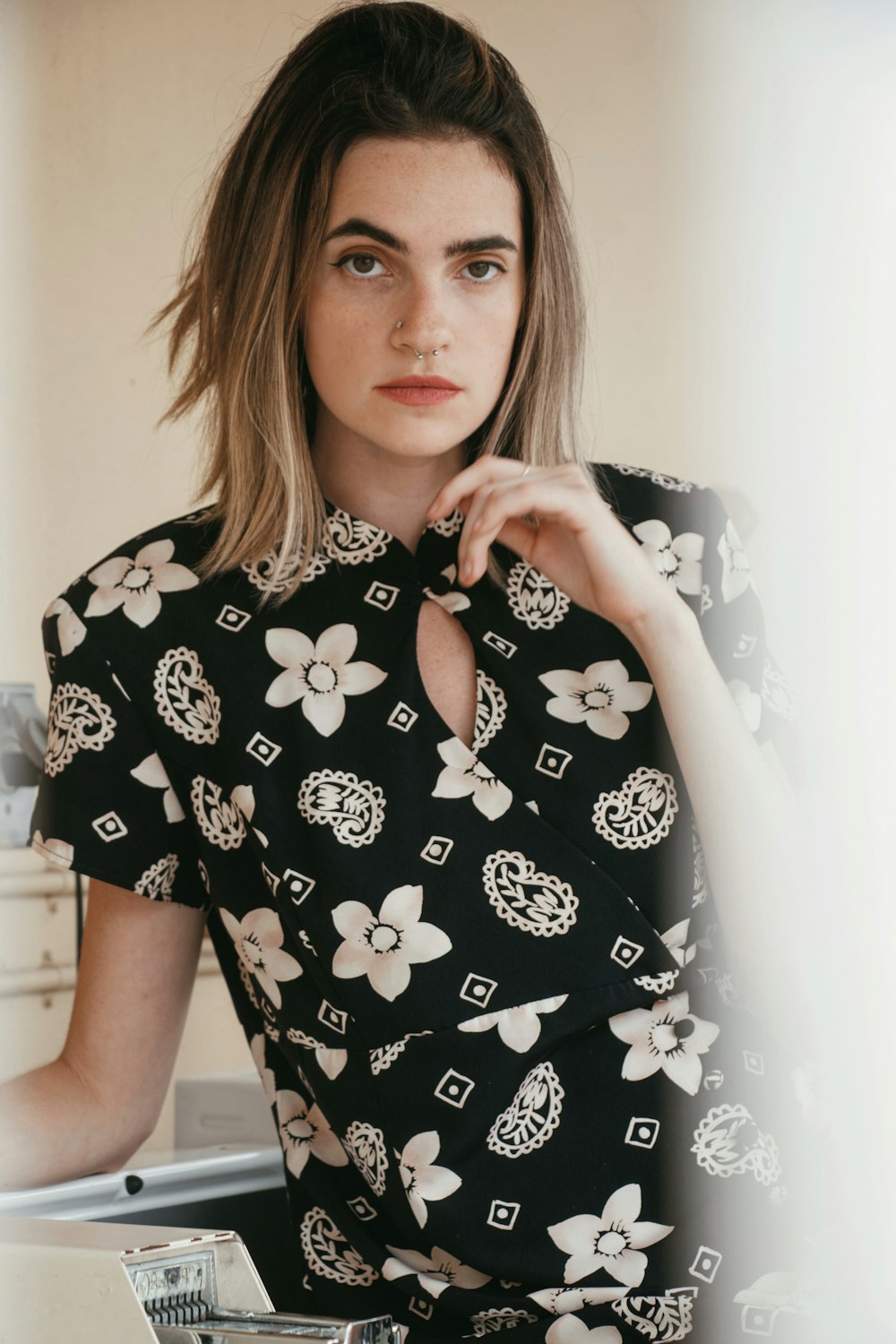woman in black and white floral shirt