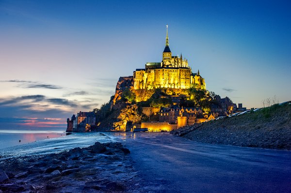 The Mont lit at night above the bay — Mont-Saint-Michel, France