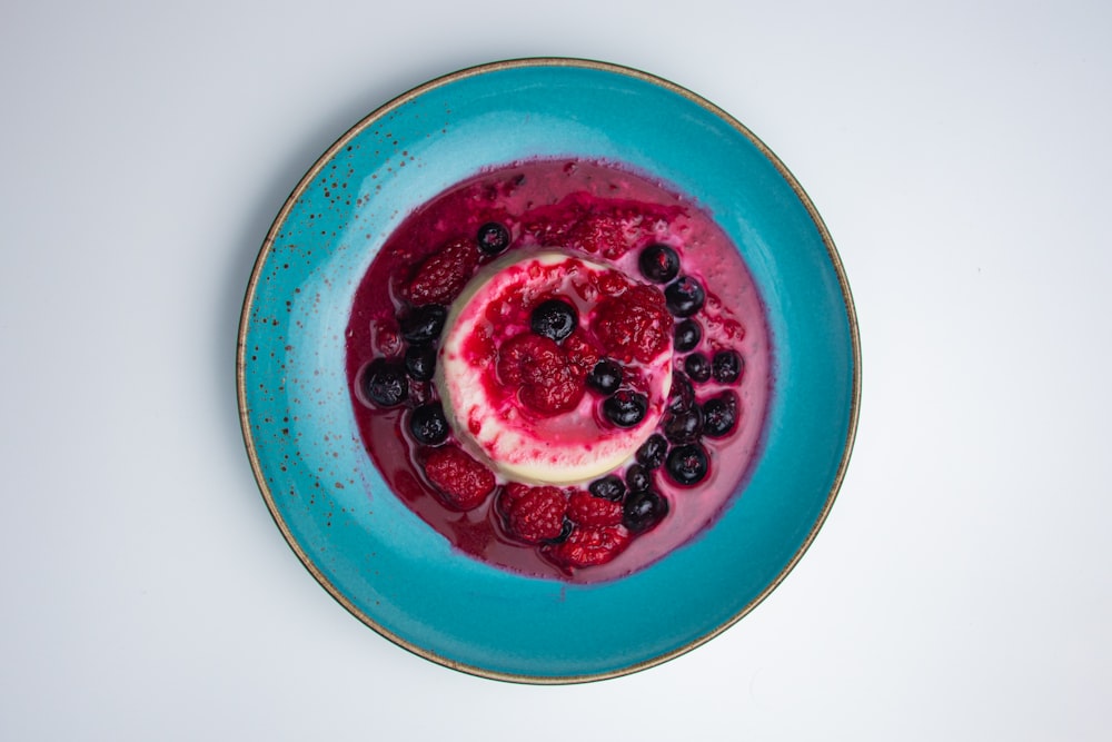 red and white round ceramic bowl