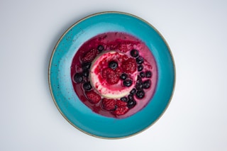 red and white round ceramic bowl