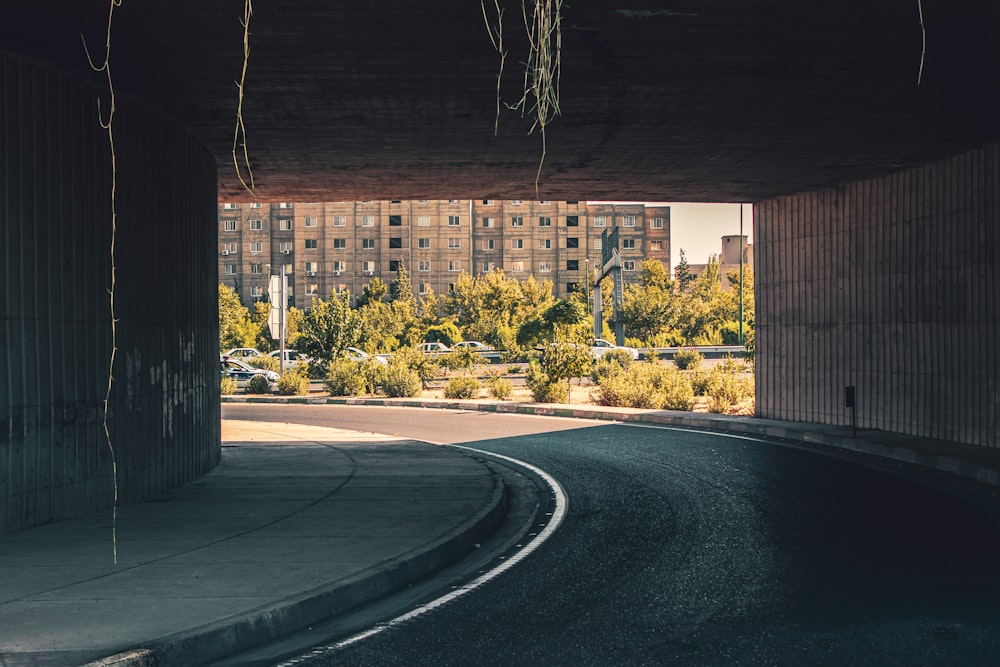 brown concrete building near green trees during daytime