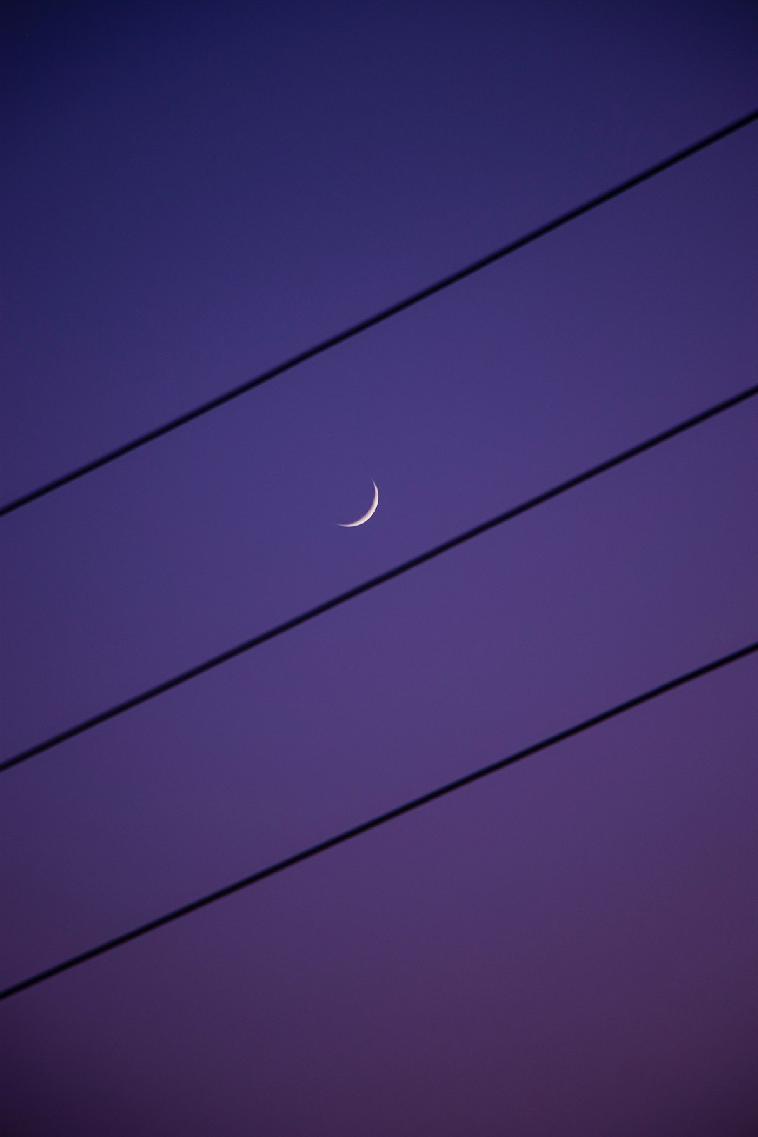 white moon in blue sky