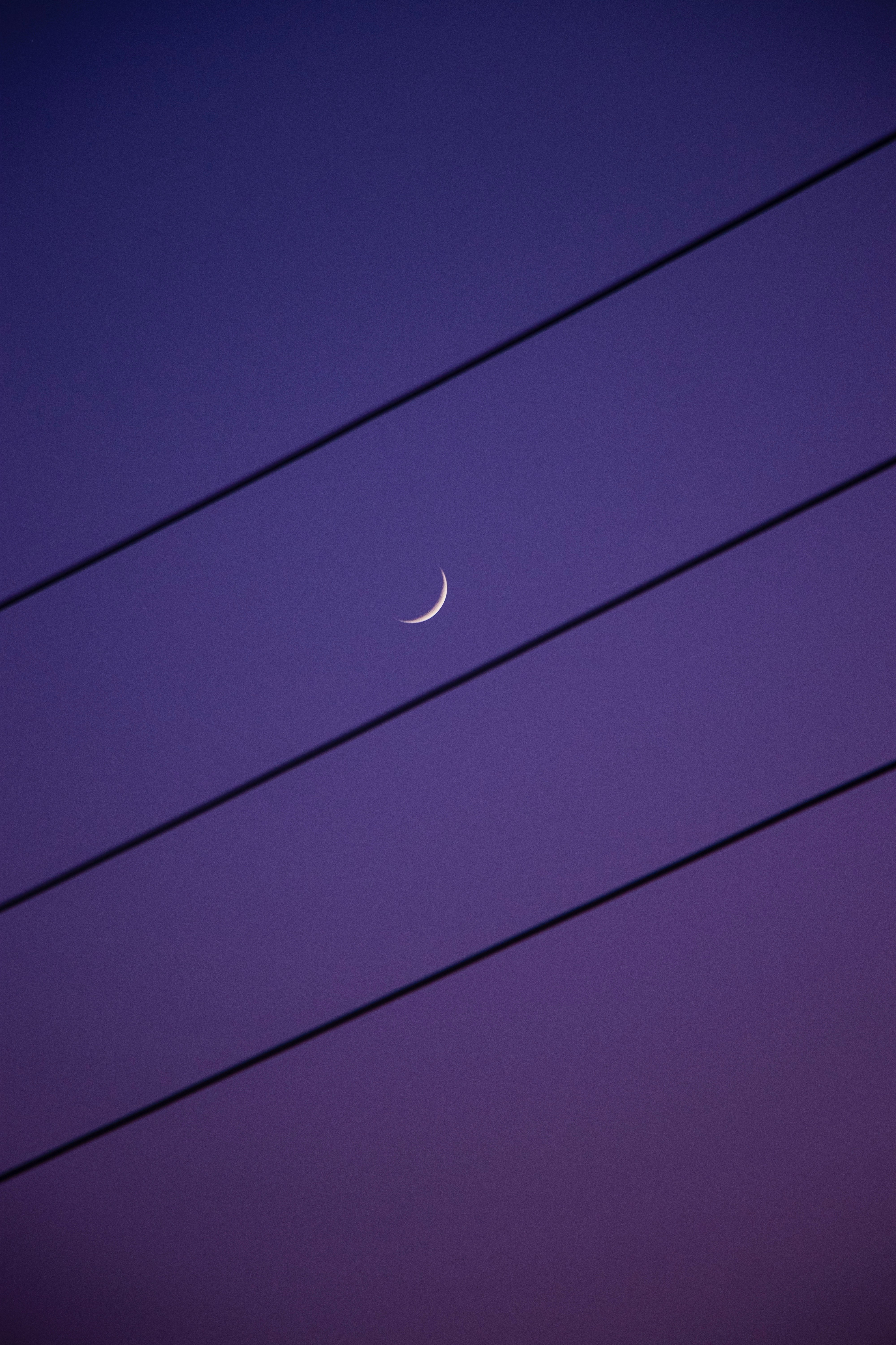 white moon in blue sky