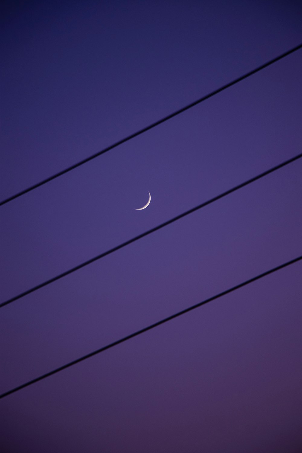 white moon in blue sky