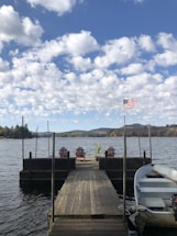 white boat on dock during daytime