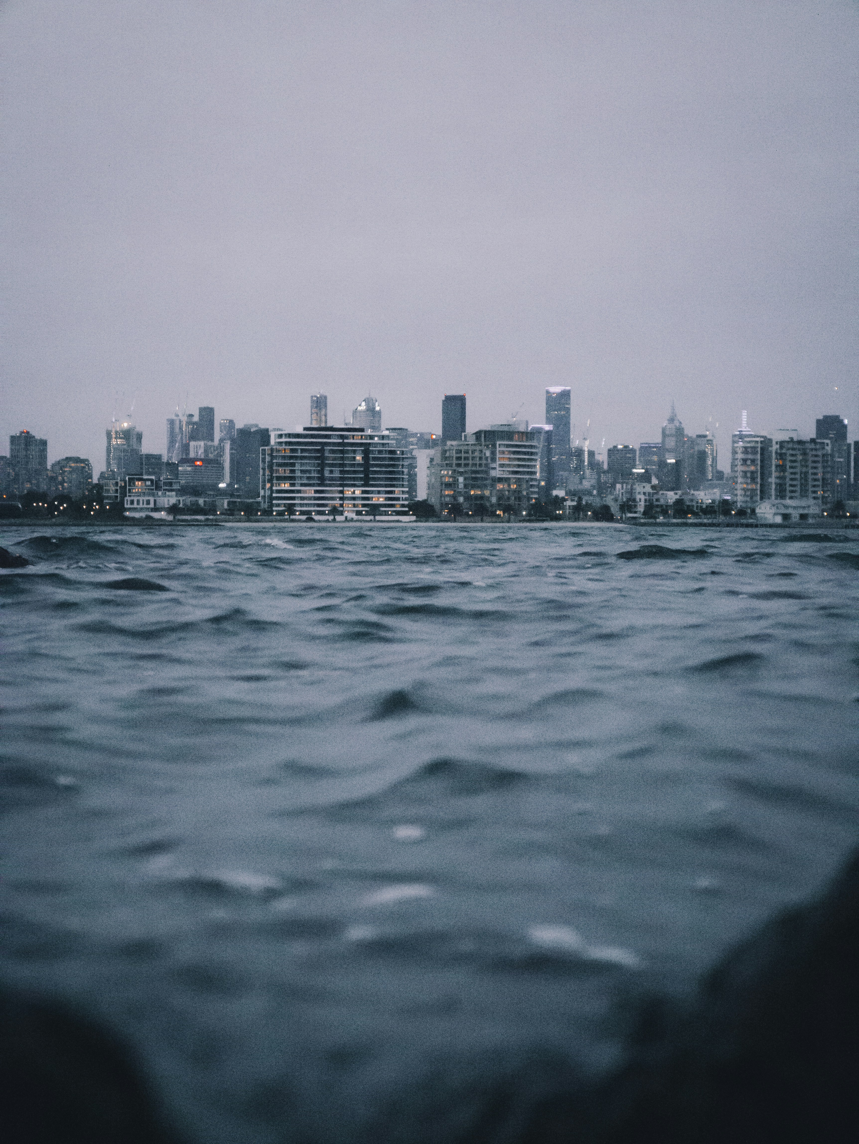 body-of-water-near-city-buildings-during-daytime