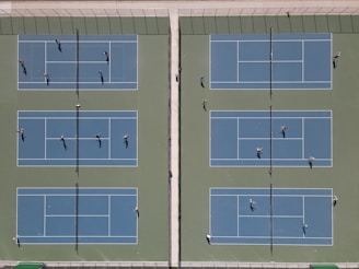 An aerial view of a tennis tournament in progress.