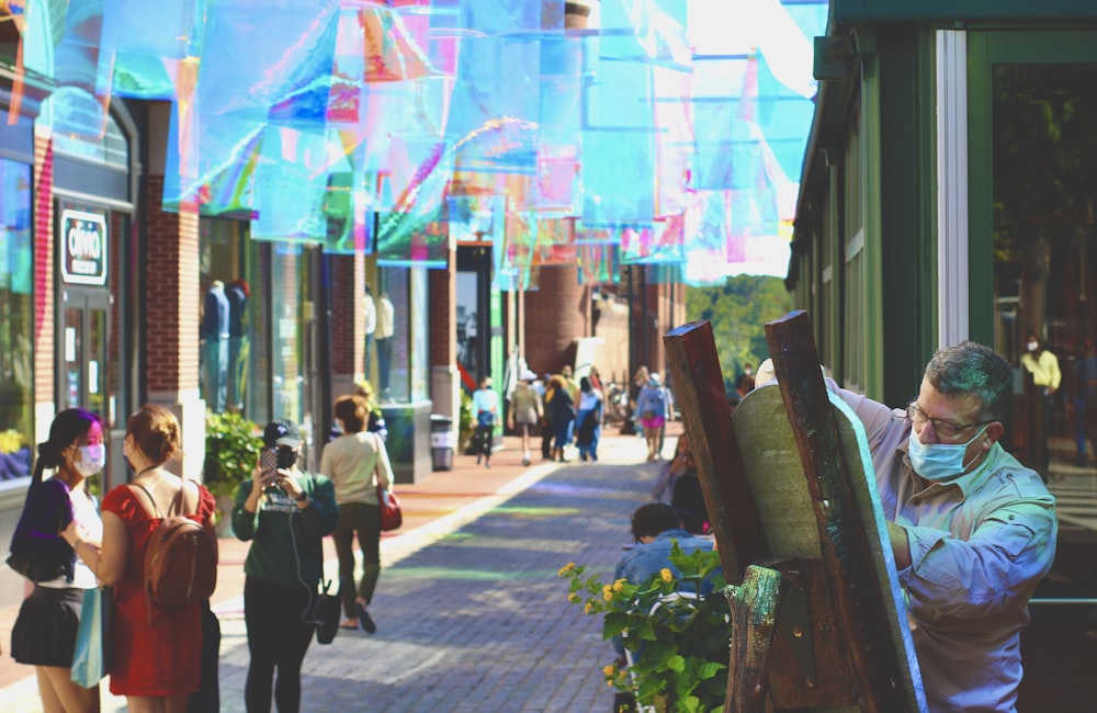 people walking on sidewalk during daytime