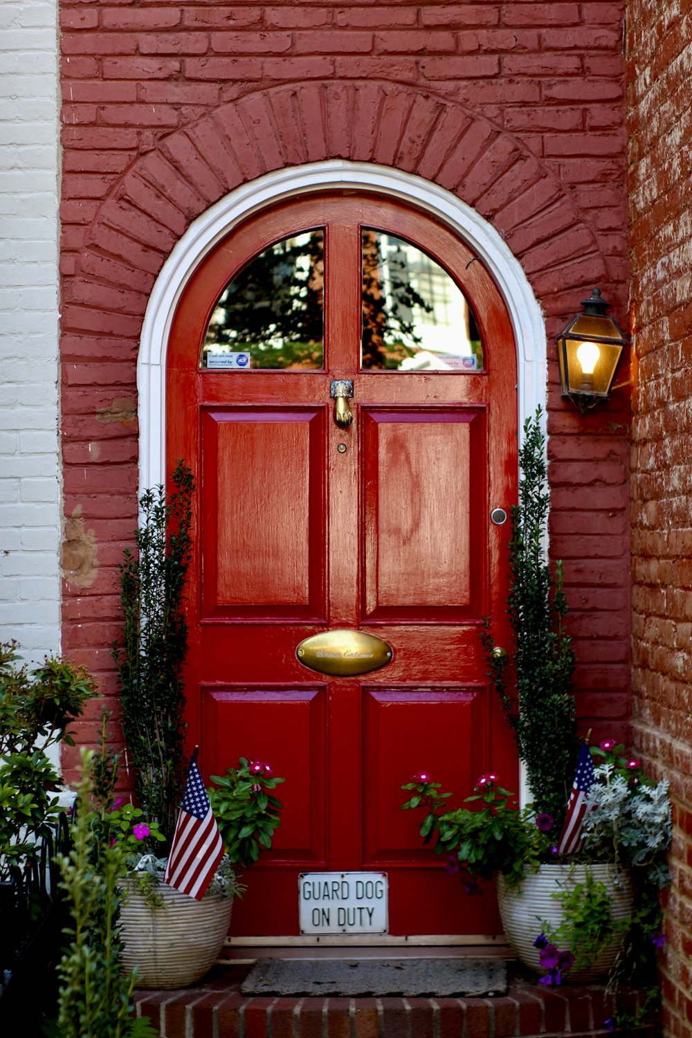 red wooden door with yellow and red flowers