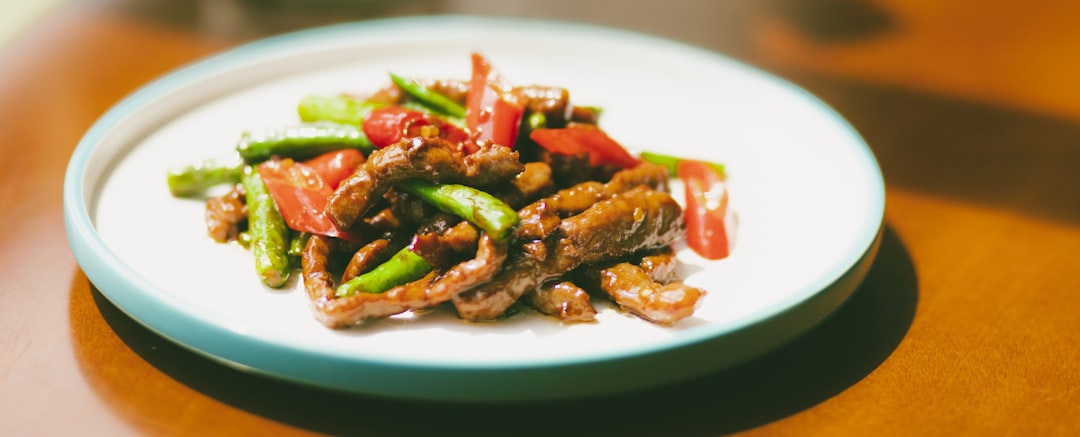 cooked food on white and green plate,