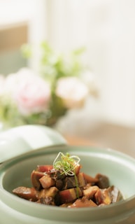 A cozy kitchen scene featuring a prepared meal in a bowl, ready to be enjoyed.