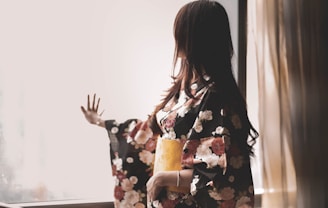woman in black white and red floral kimono