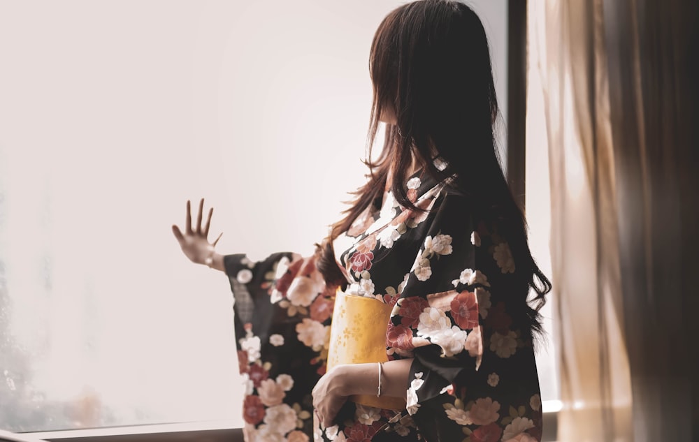 woman in black white and red floral kimono