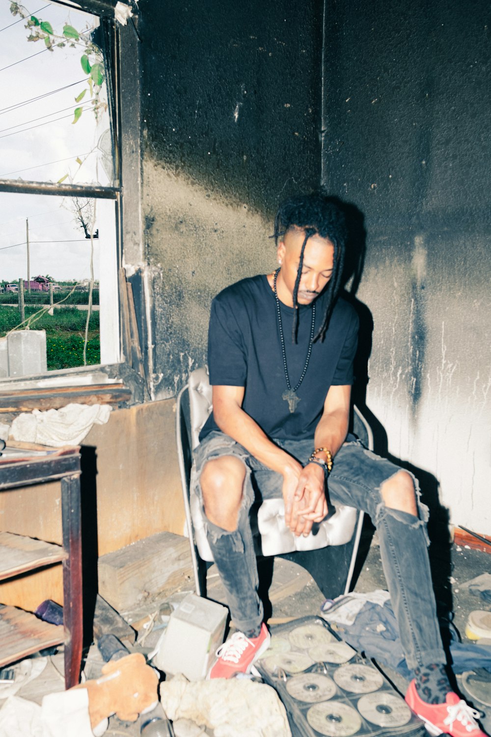 man in black polo shirt sitting on black chair