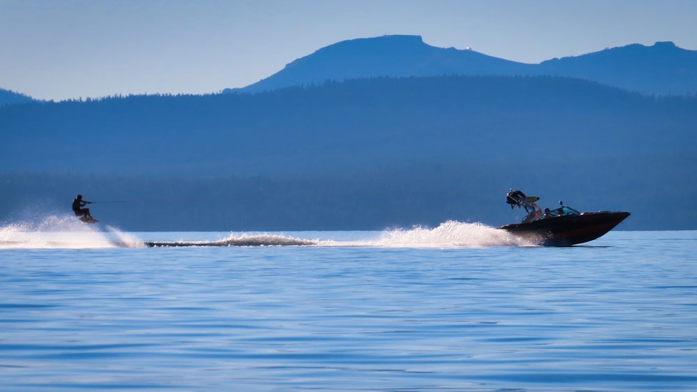 person surfing on sea waves during daytime