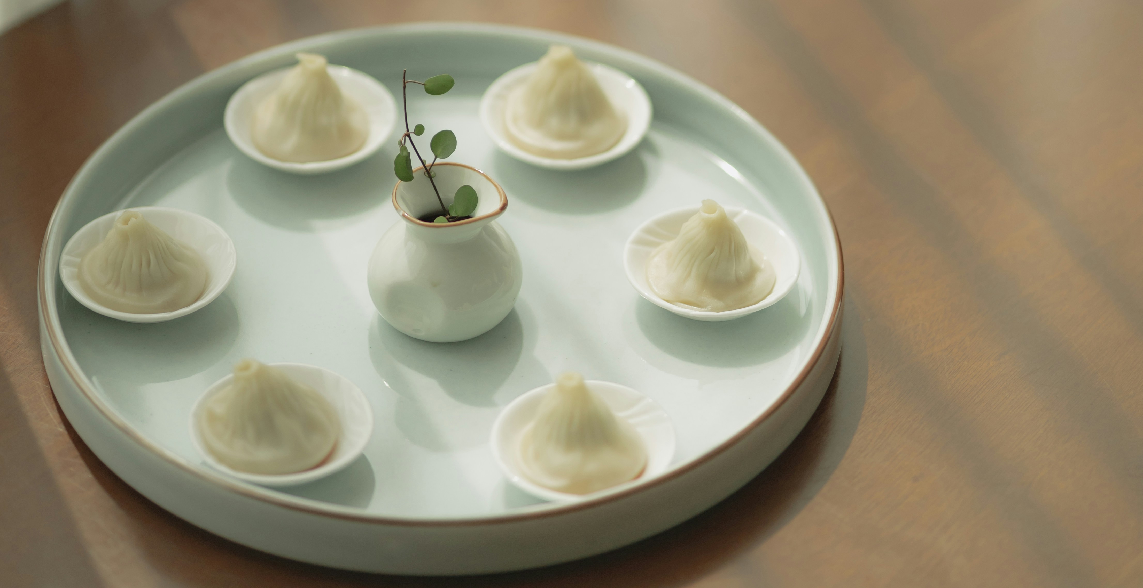 white ceramic bowls on white ceramic plate