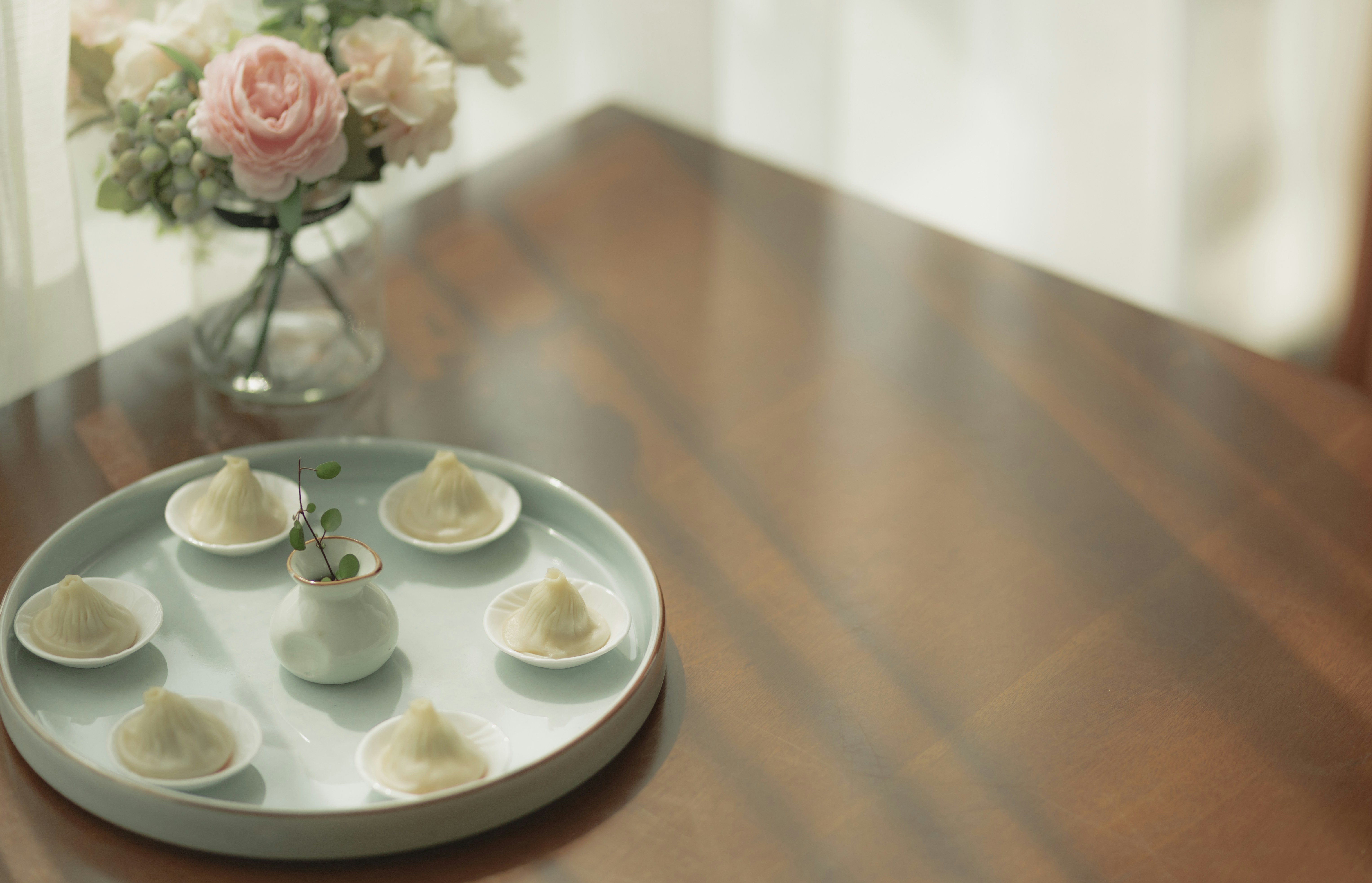 white ceramic plate on brown wooden table