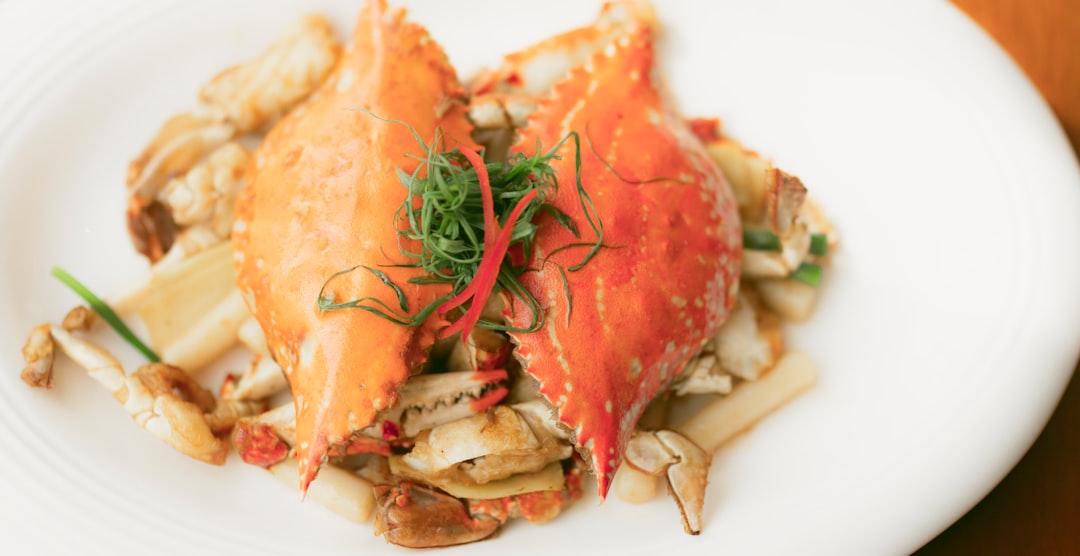  cooked shrimp on white ceramic plate crab