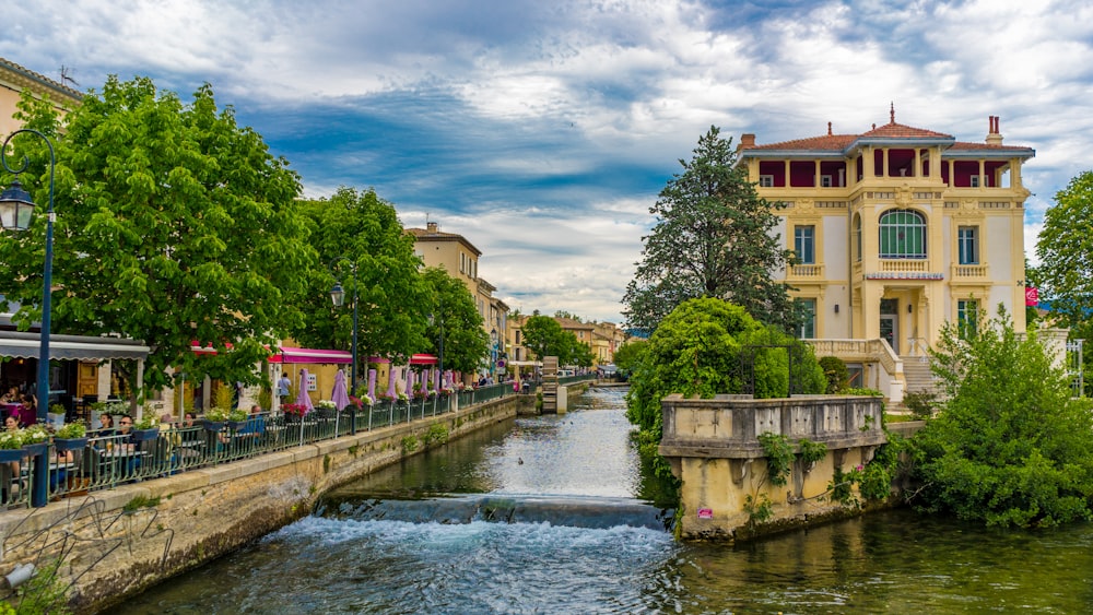 people walking on bridge over river during daytime