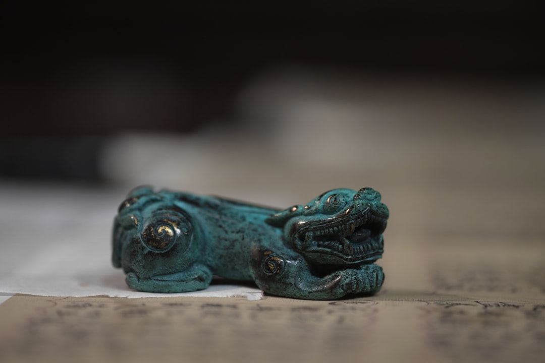 blue and green frog figurine