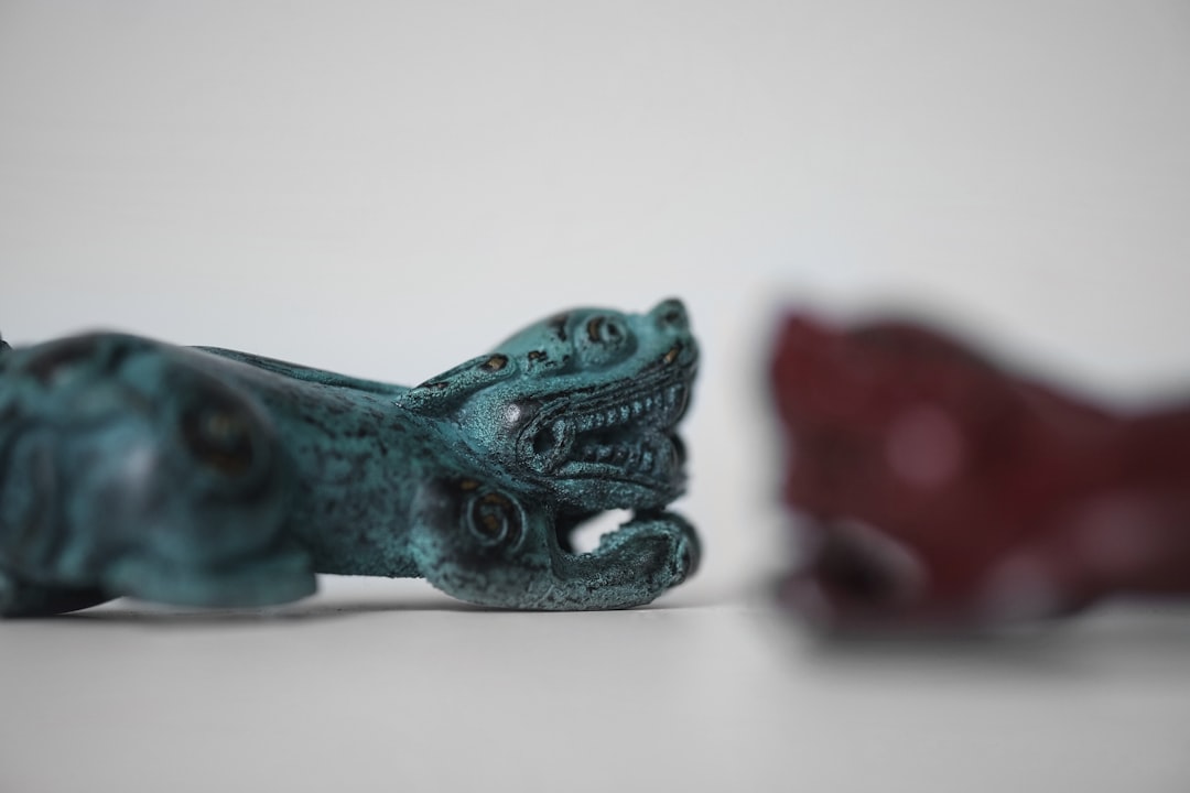 blue dragon figurine on white table