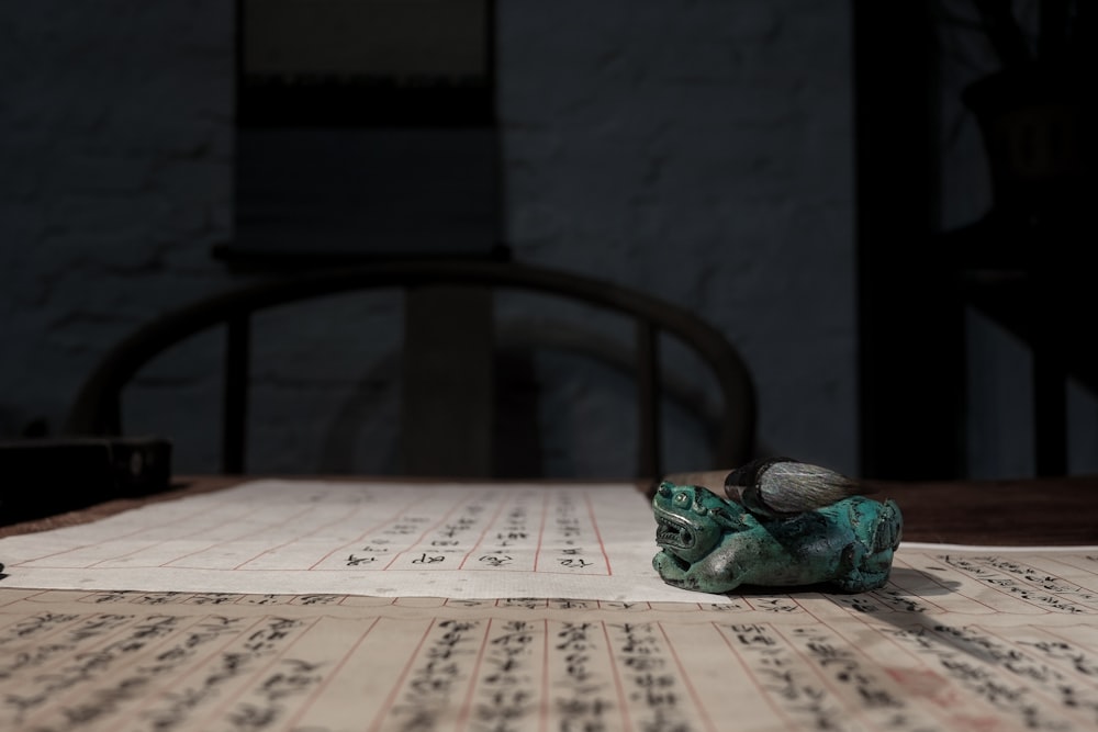 green textile on white and brown table