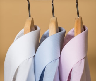 white and purple clothes hangers