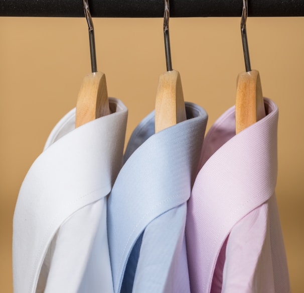 white and purple clothes hangers