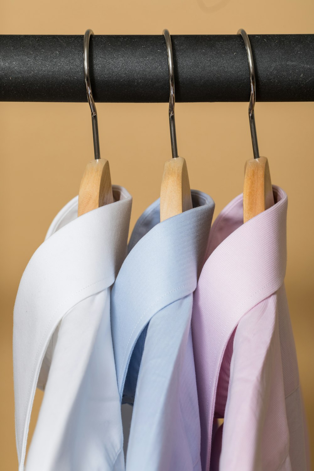 white and purple clothes hangers