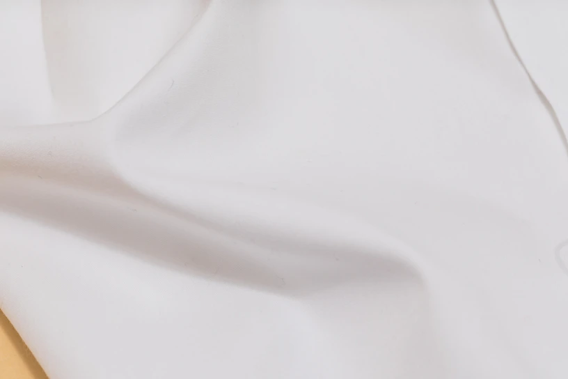 Close-up of smooth white nylon PA6 sheet with subtle texture under soft lighting