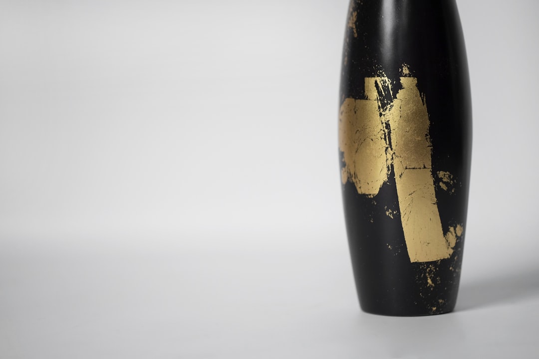 black and gold glass bottle