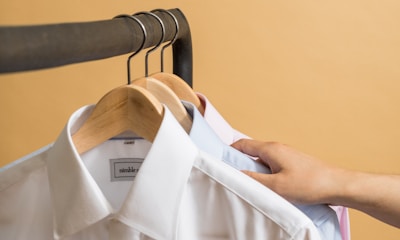 white button up shirt on clothes hanger