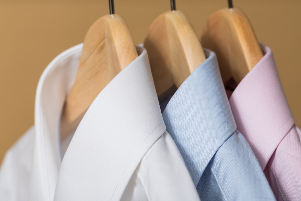 white and purple button up shirt