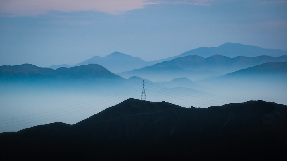 mountain range under blue sky during daytime