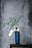 white flowers in blue vase