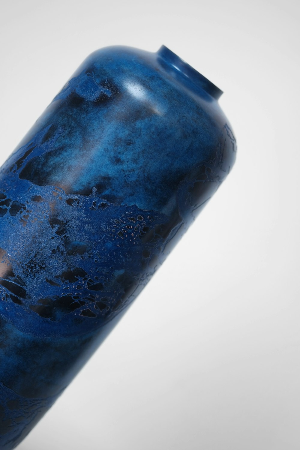 blue and white ice in clear plastic bottle