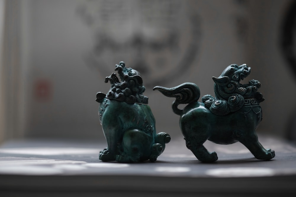 green ceramic elephant figurine on white table