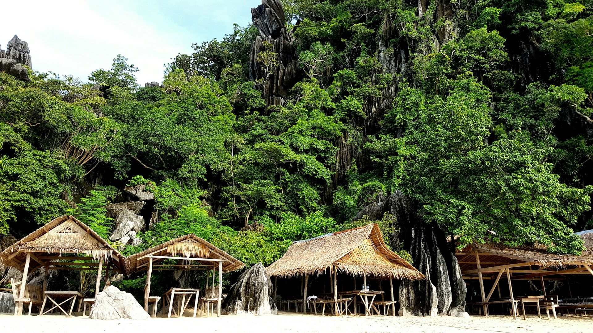 woman wearing yellow long-sleeved dress under white clouds and blue sky during daytime