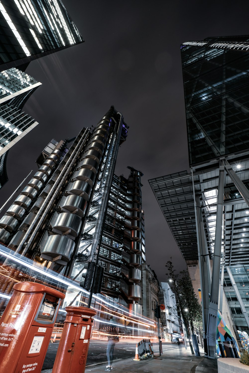 low angle photography of high rise building during night time