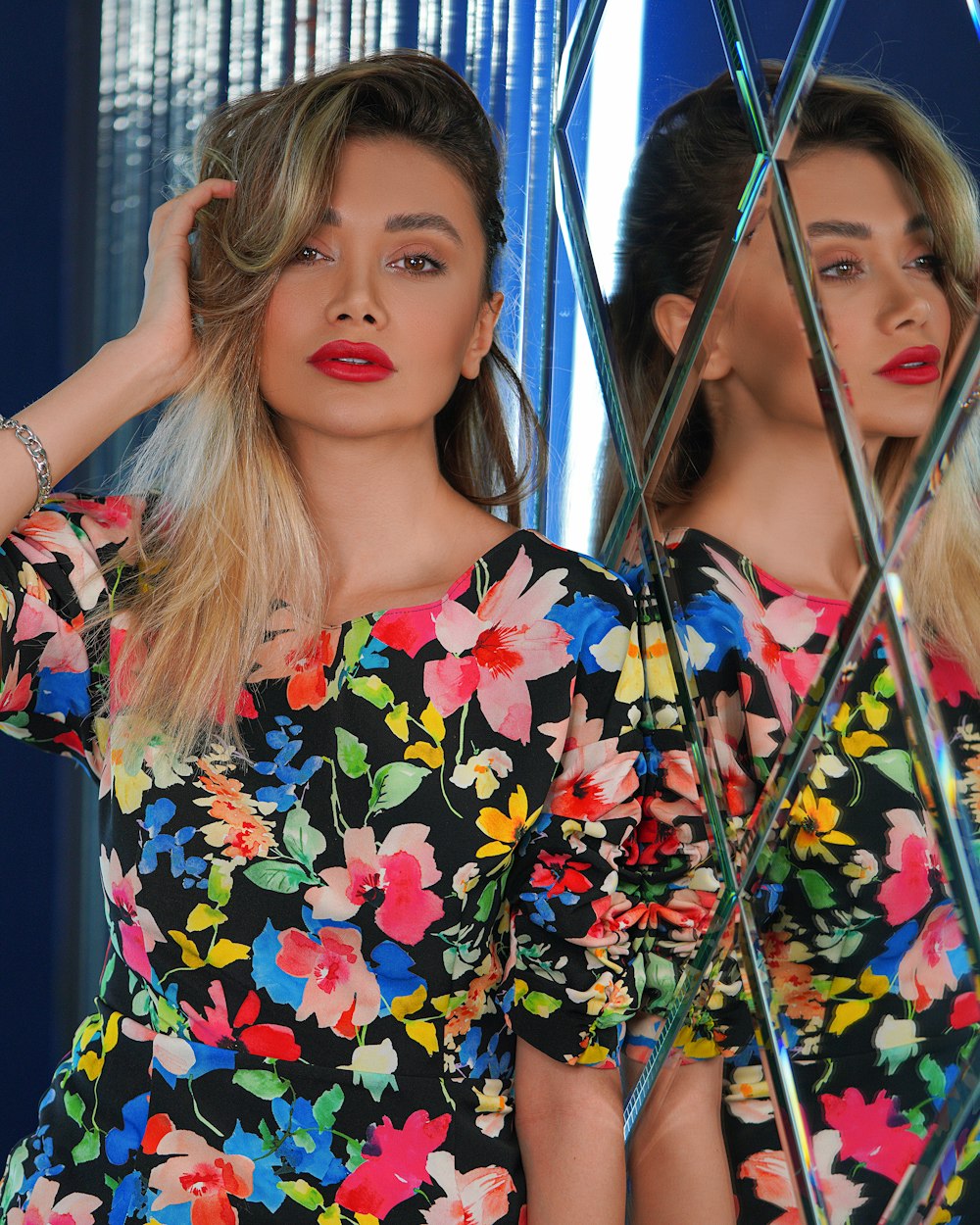 woman in blue yellow and red floral dress