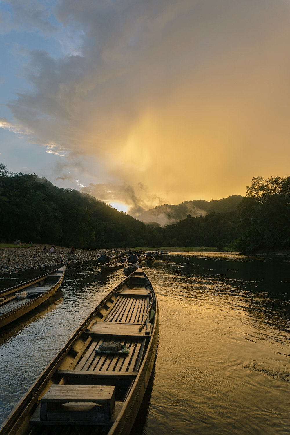 brown wooden boat on river during daytime