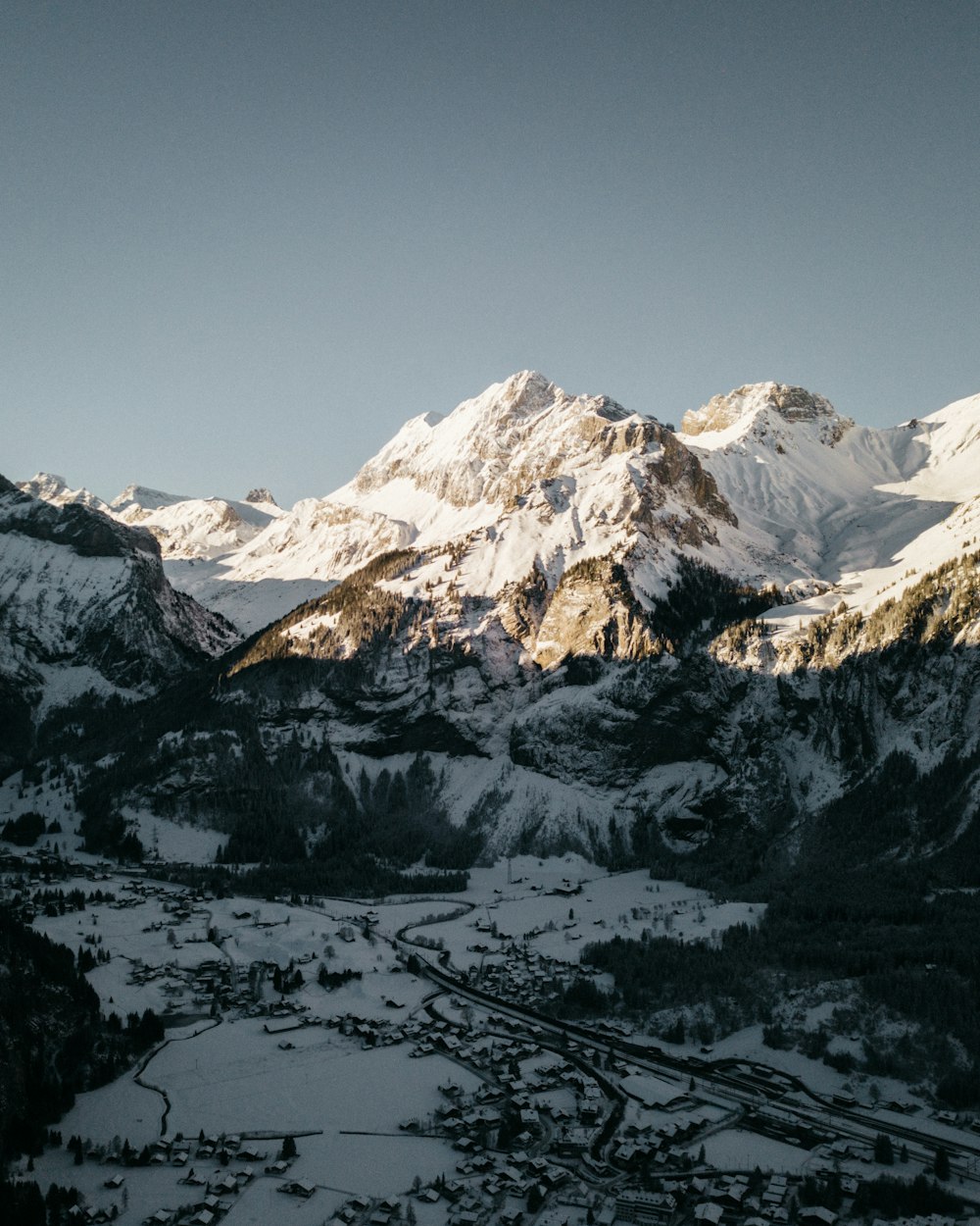 snow covered mountain during daytime