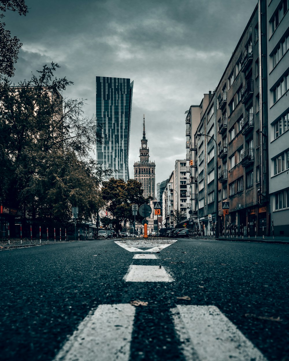 people walking on sidewalk near high rise buildings during daytime